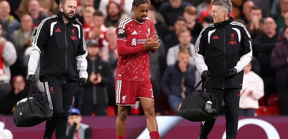 Liverpool player receiving medical attention from staff