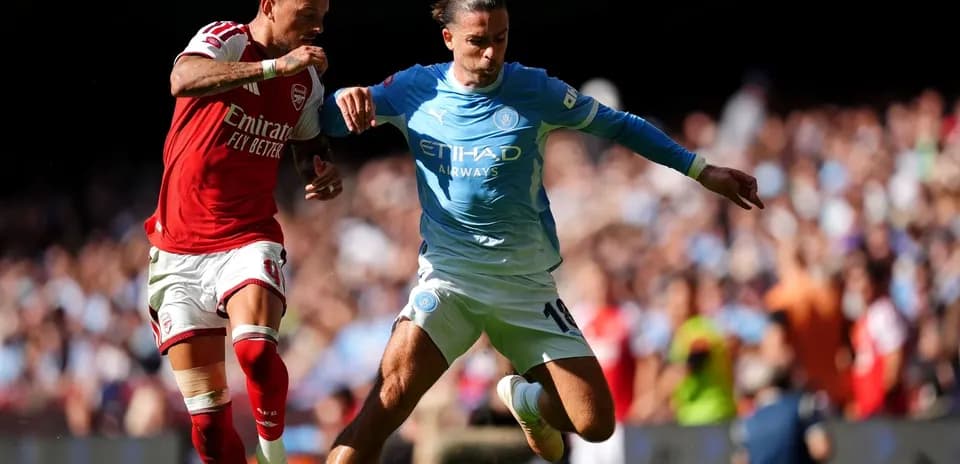 Two players contesting the ball during match