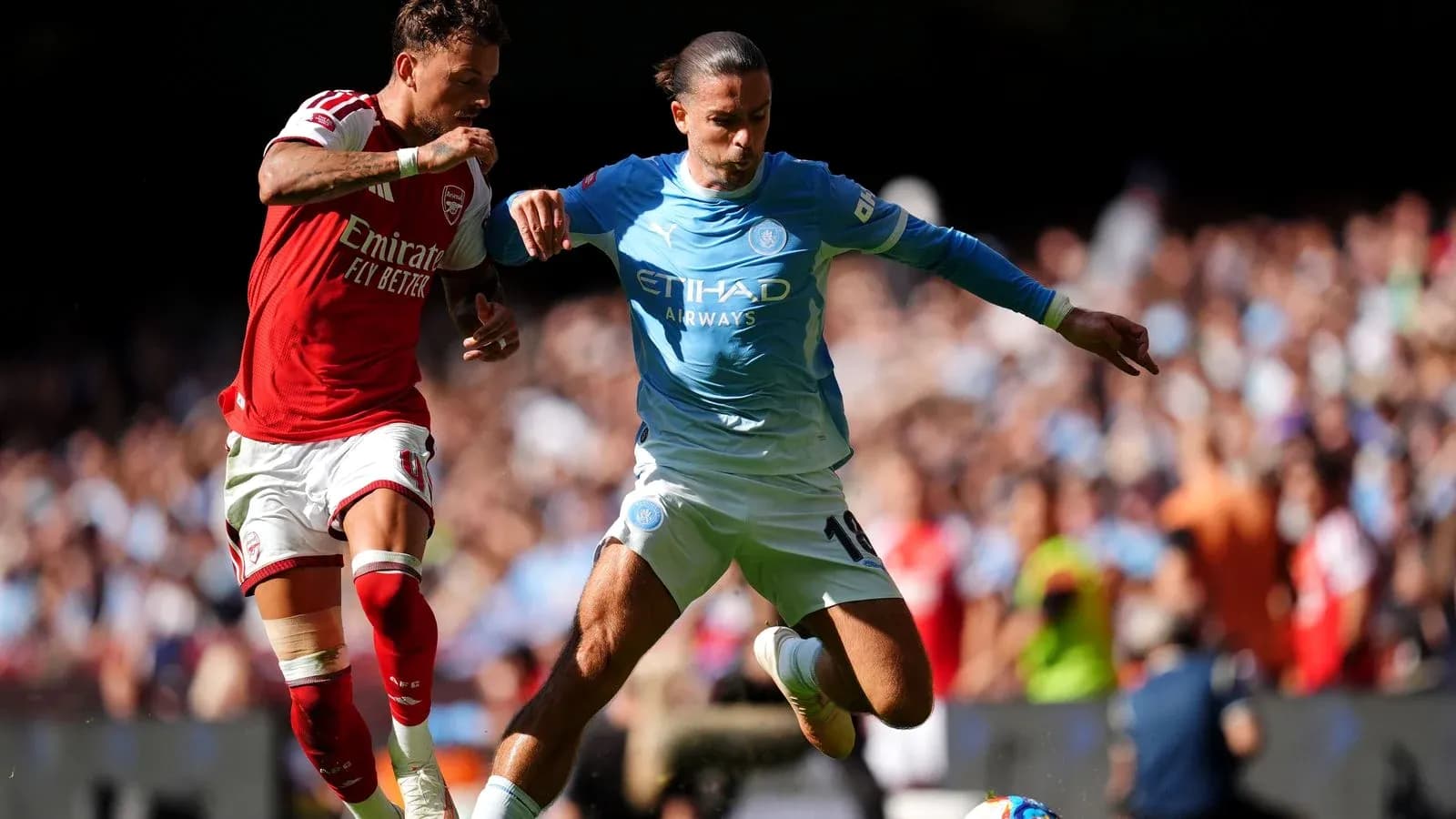 Two players contesting the ball during match