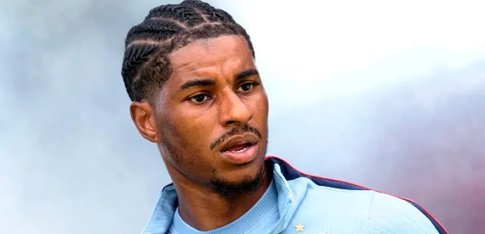 Player in training kit with braided hairstyle