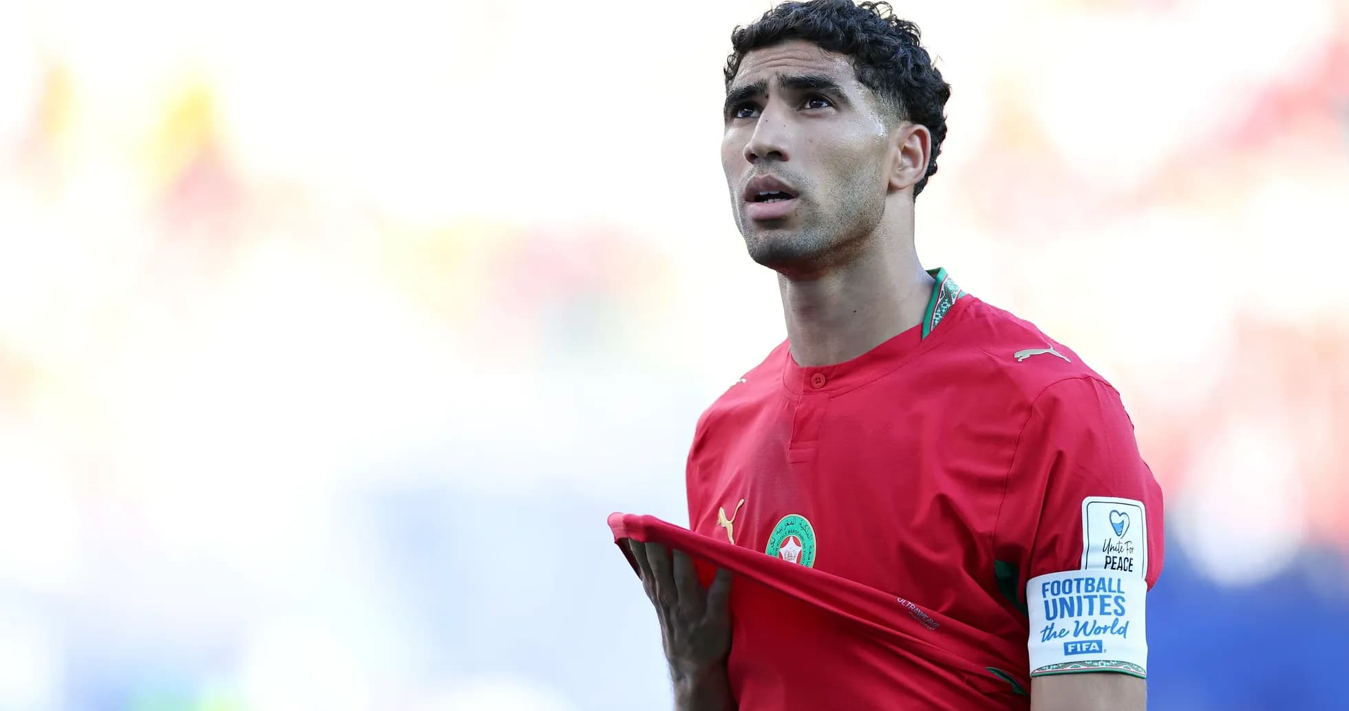 Moroccan player adjusting his jersey on the field