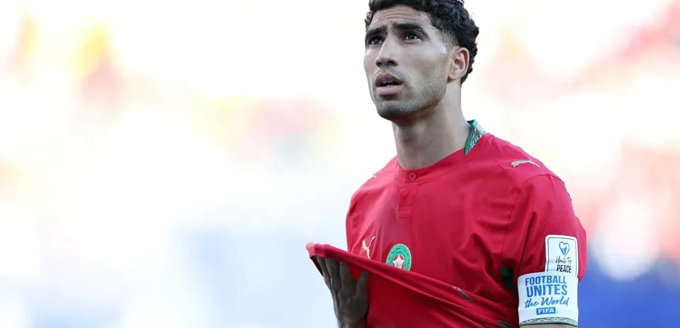 Moroccan player adjusting his jersey on the field