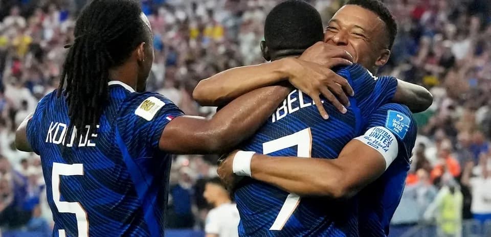 Players celebrating a goal during France match