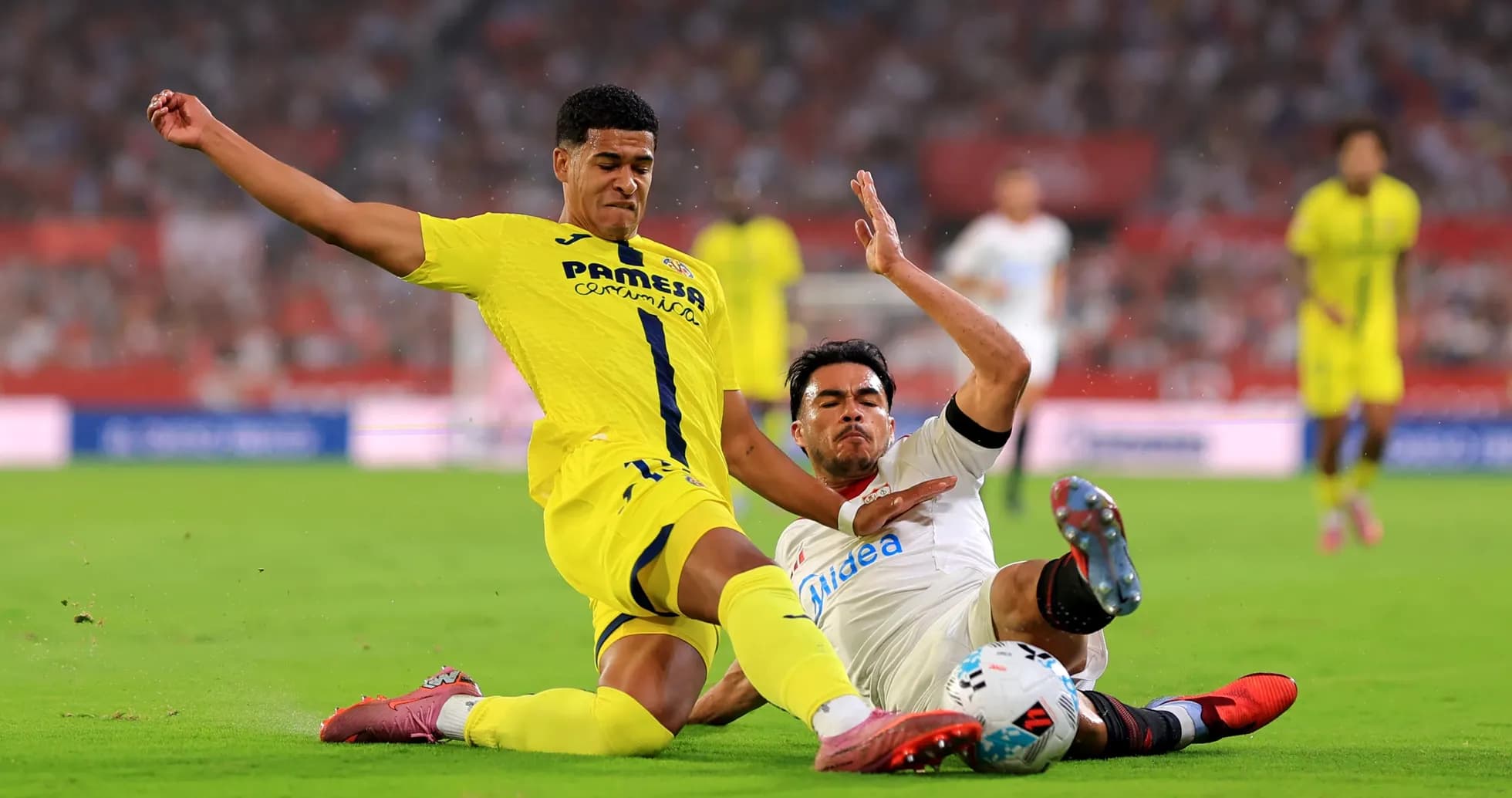 Players clashing during Villarreal vs Sevilla match