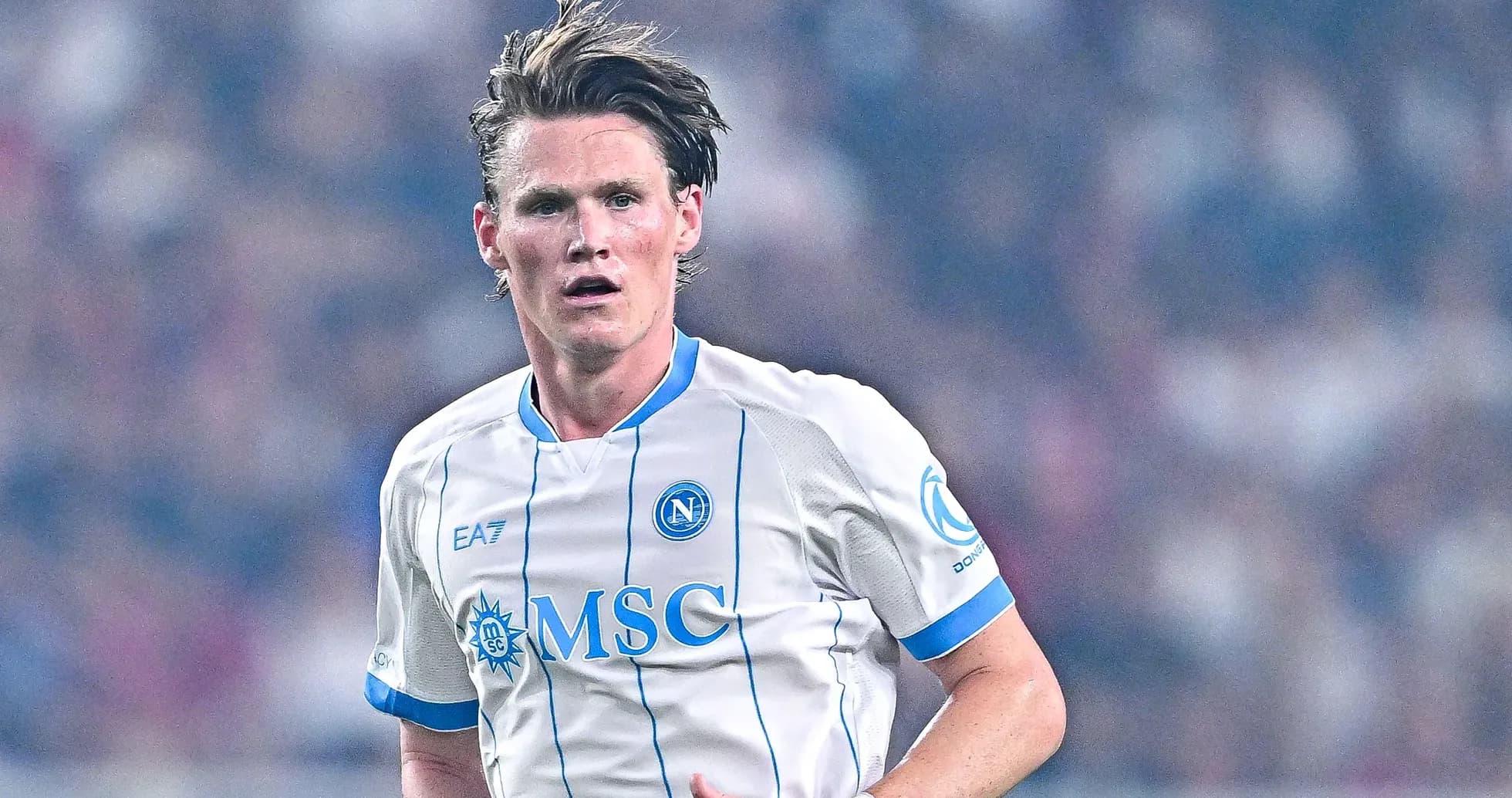 Player in Napoli jersey running during match
