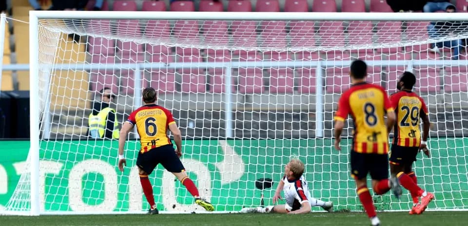 Goalkeeper attempting to save a shot on goal