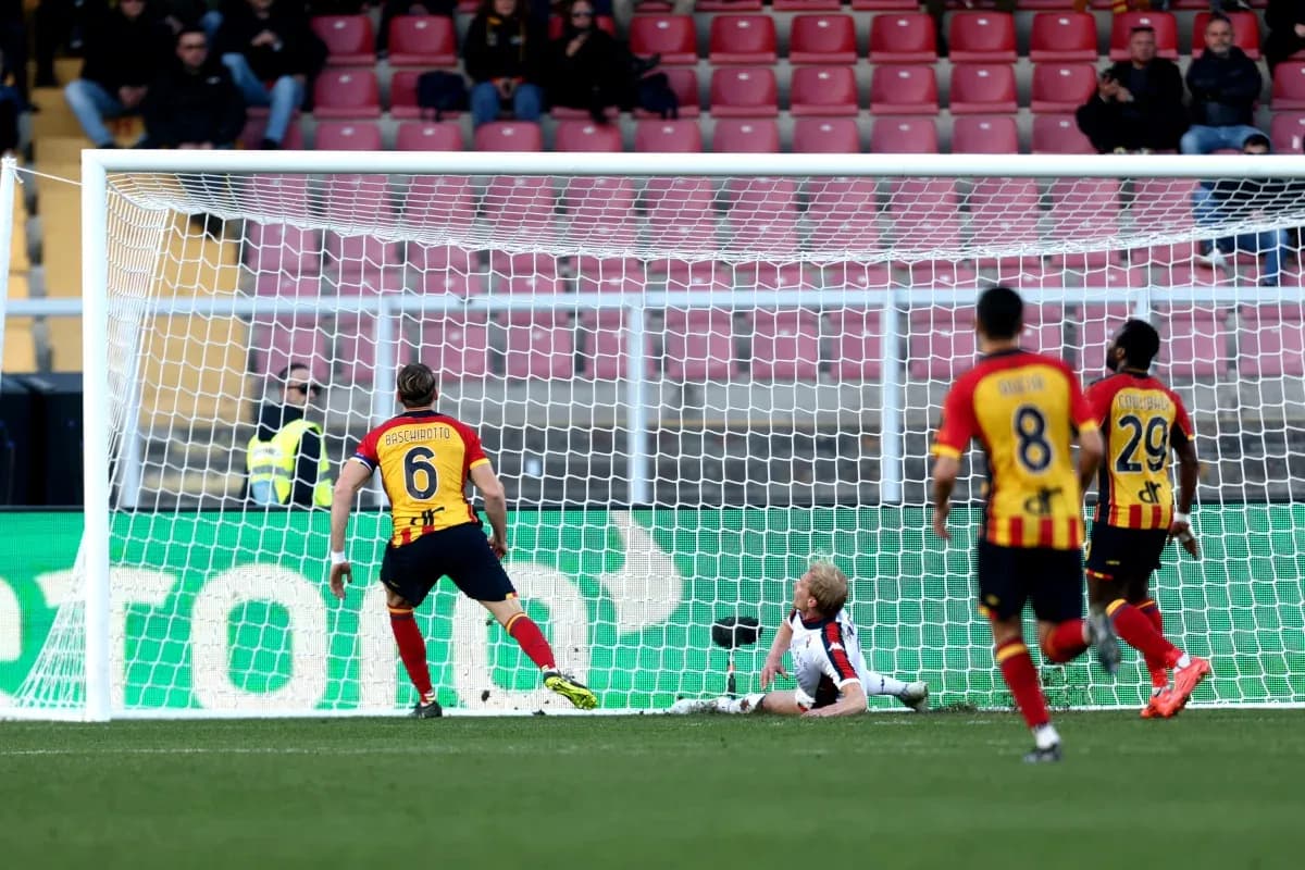 Goalkeeper attempting to save a shot on goal