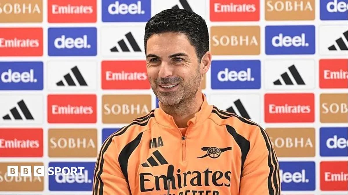Manager speaking at press conference with backdrop
