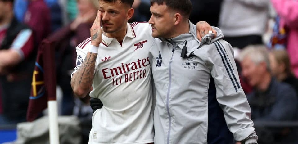 Player receiving support from staff after injury