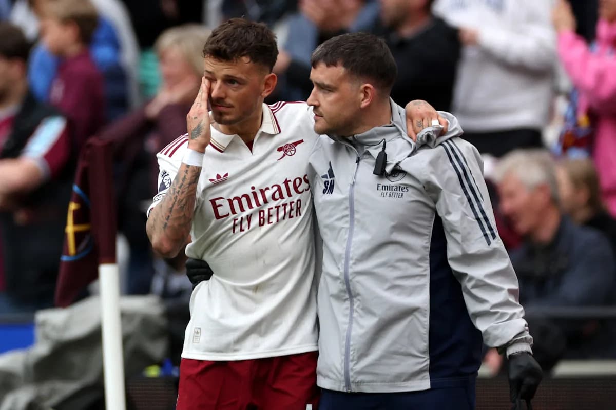 Player receiving support from staff after injury