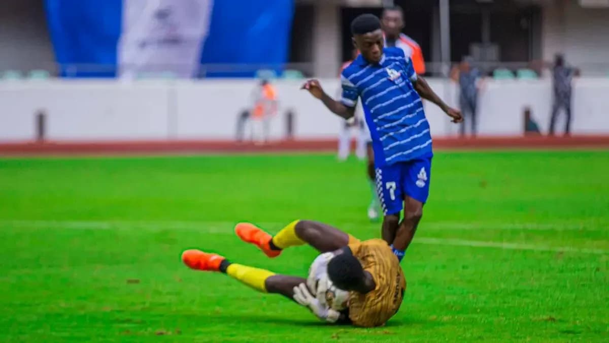 Player attempting to tackle goalkeeper during match