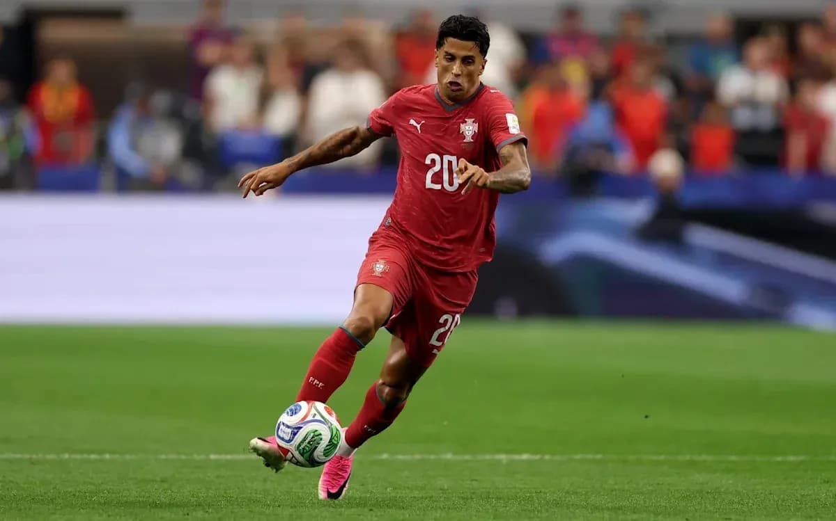 Player in red jersey sprinting with soccer ball