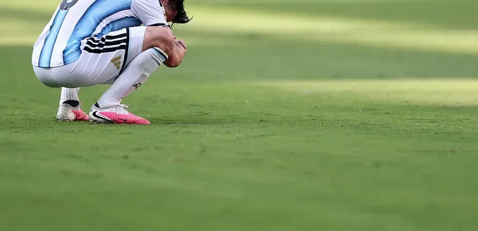 Player kneeling on the field after match