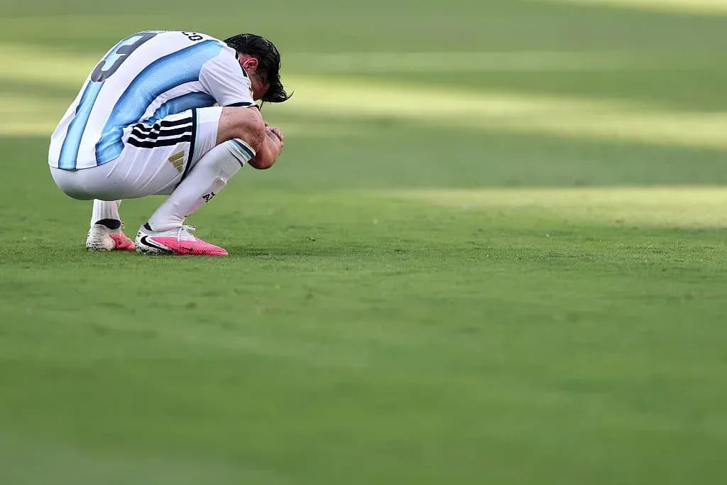 Player kneeling on the field after match