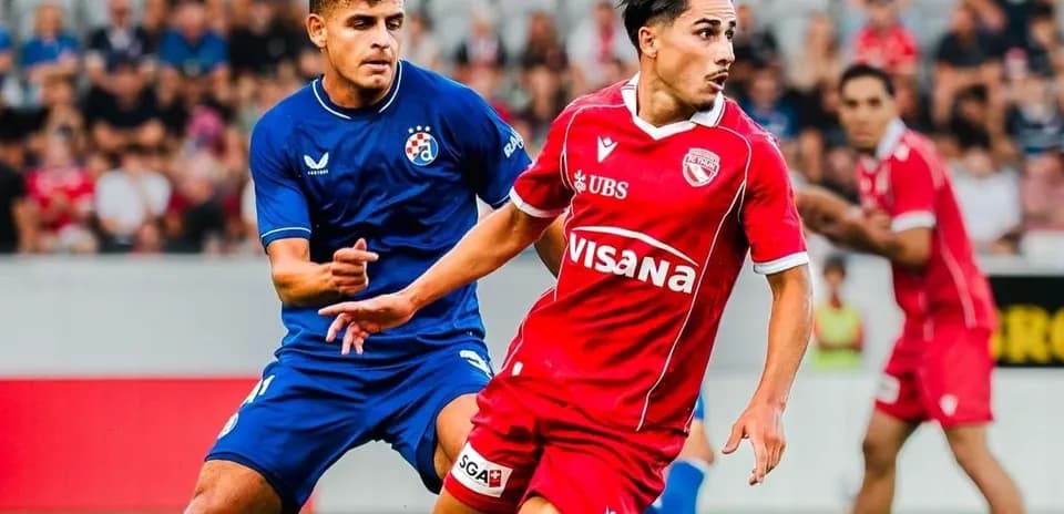 FC Thun player dribbling against Dinamo Zagreb