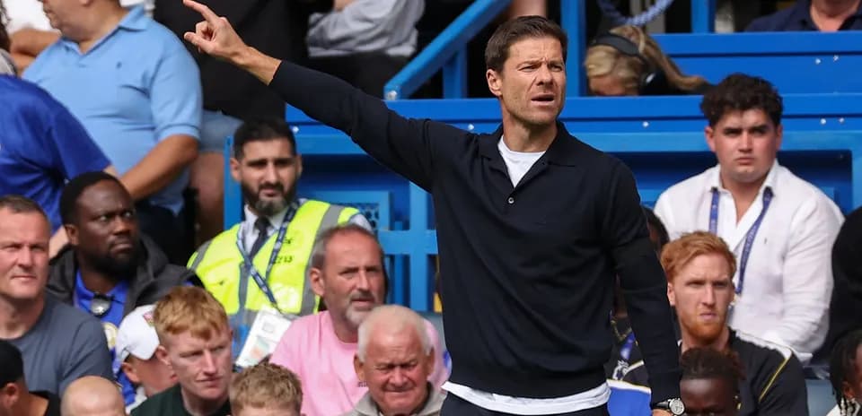 Coach giving instructions during a match from sidelines