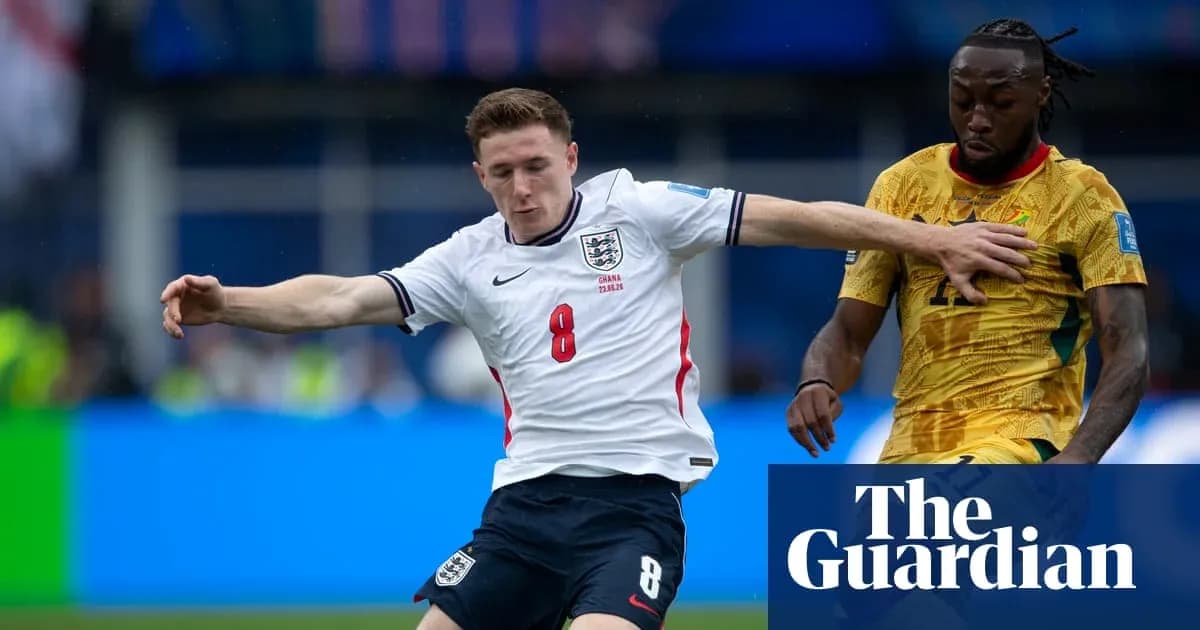England player tackles opponent during football match