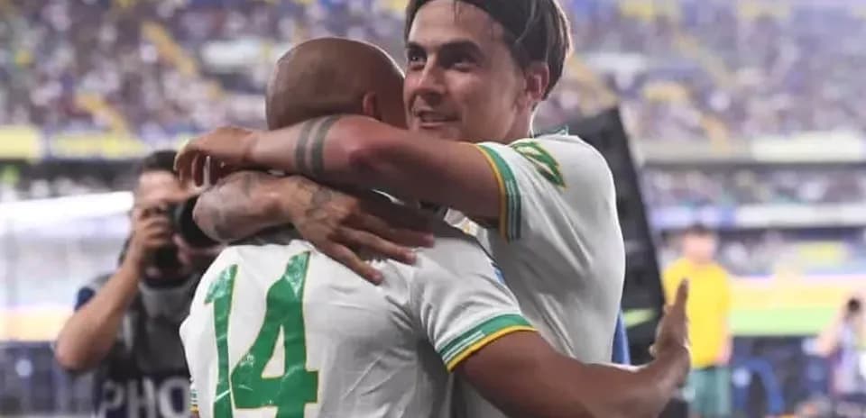 Players celebrating an achievement with a hug