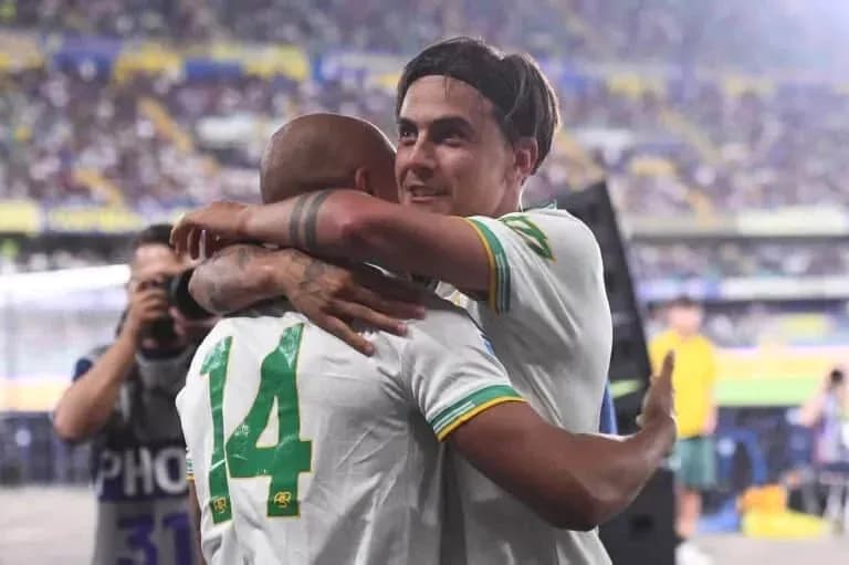 Players celebrating an achievement with a hug