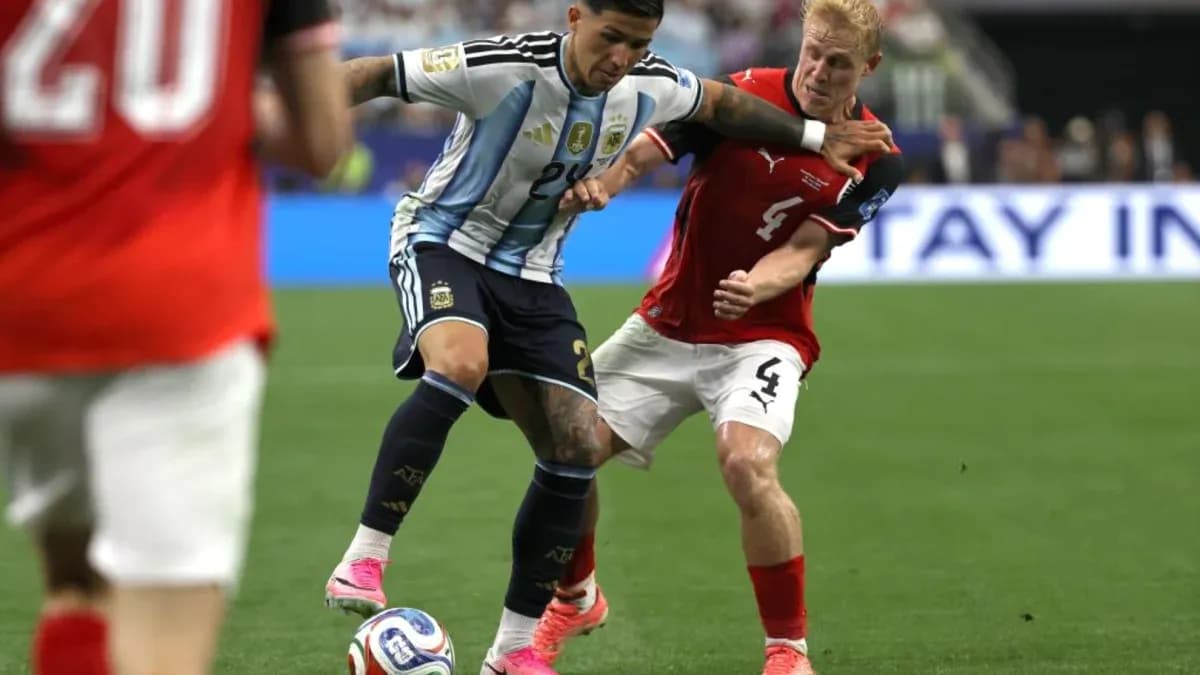 Argentinian player challenged by Austrian defender during match