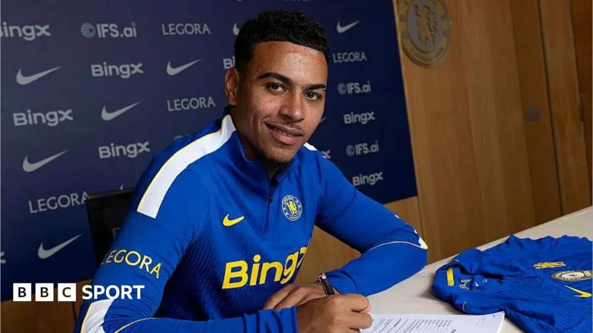 Player signing contract at club announcement event