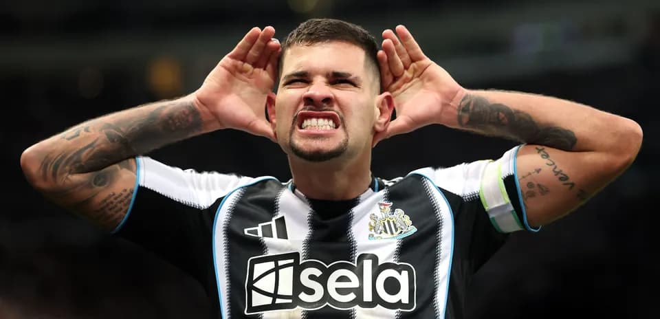 Player celebrating with hands on ears after goal