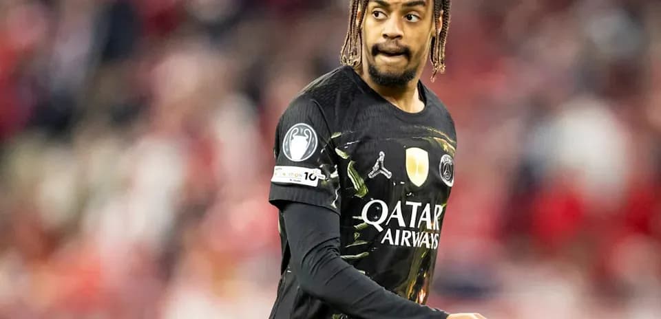 Player in black jersey during match on field