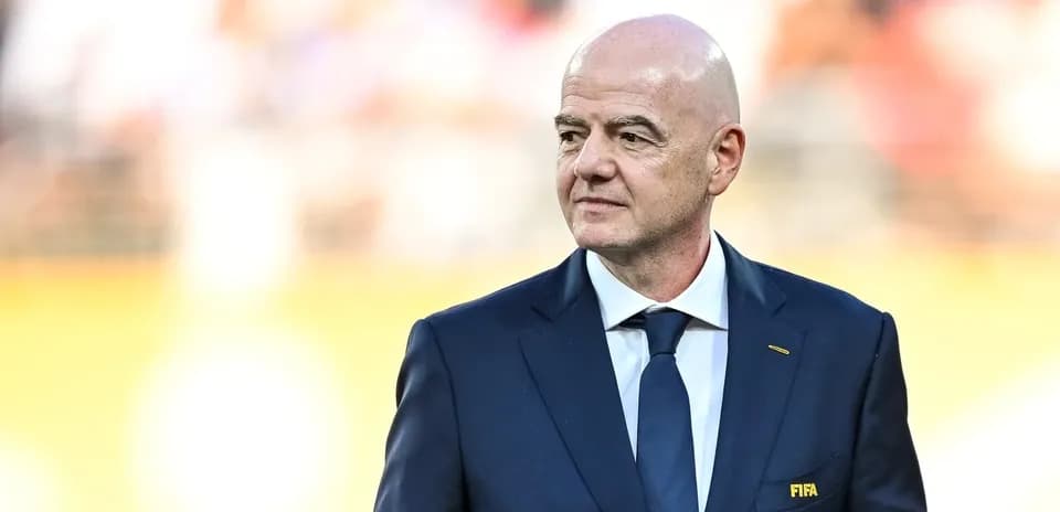FIFA president standing on the field during event