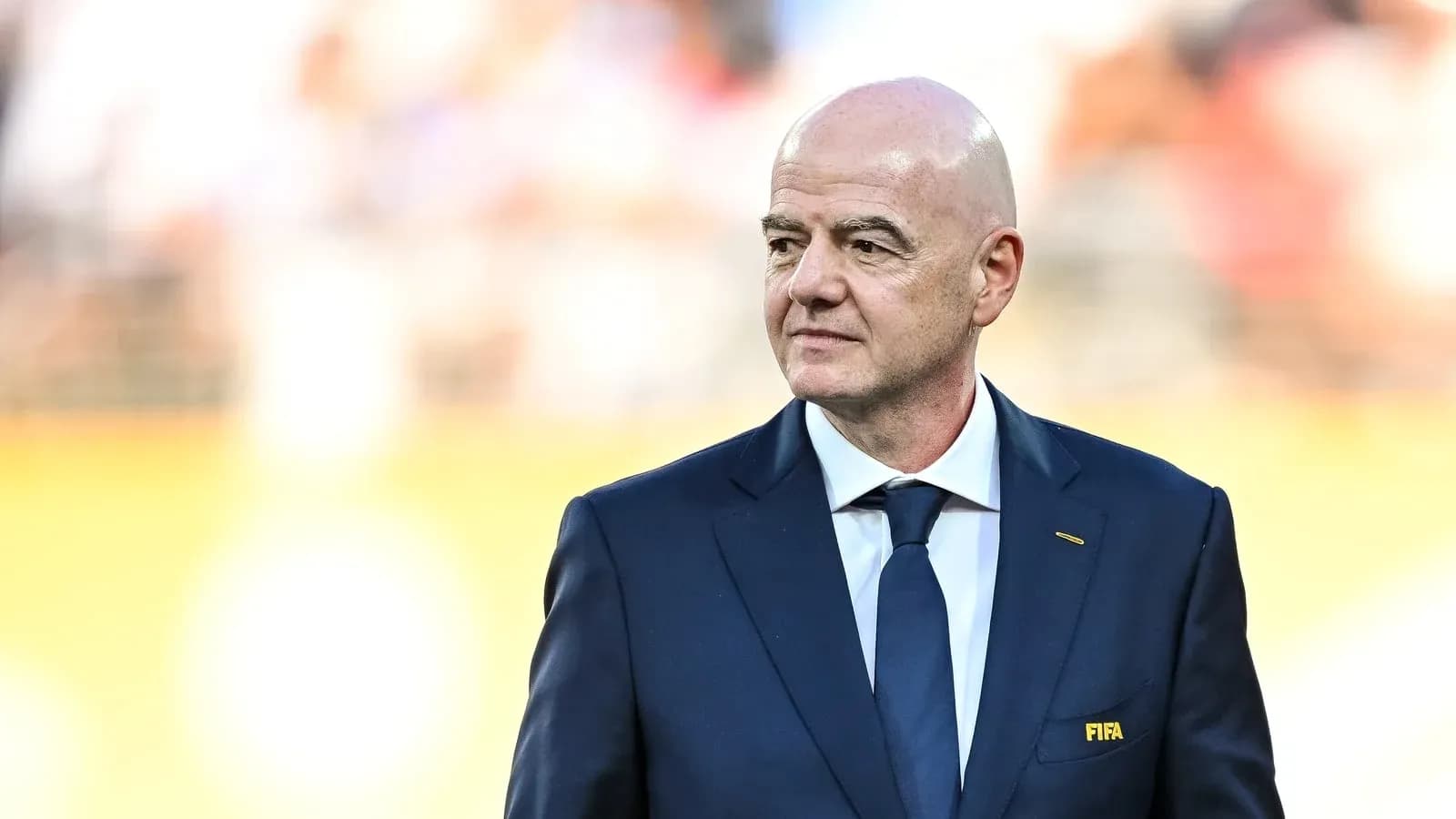 FIFA president standing on the field during event