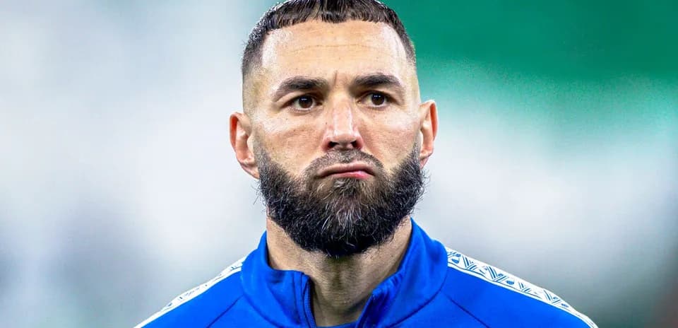 Football player in blue jersey with beard