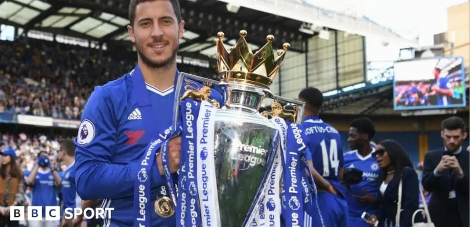 Player holding Premier League trophy at celebration event
