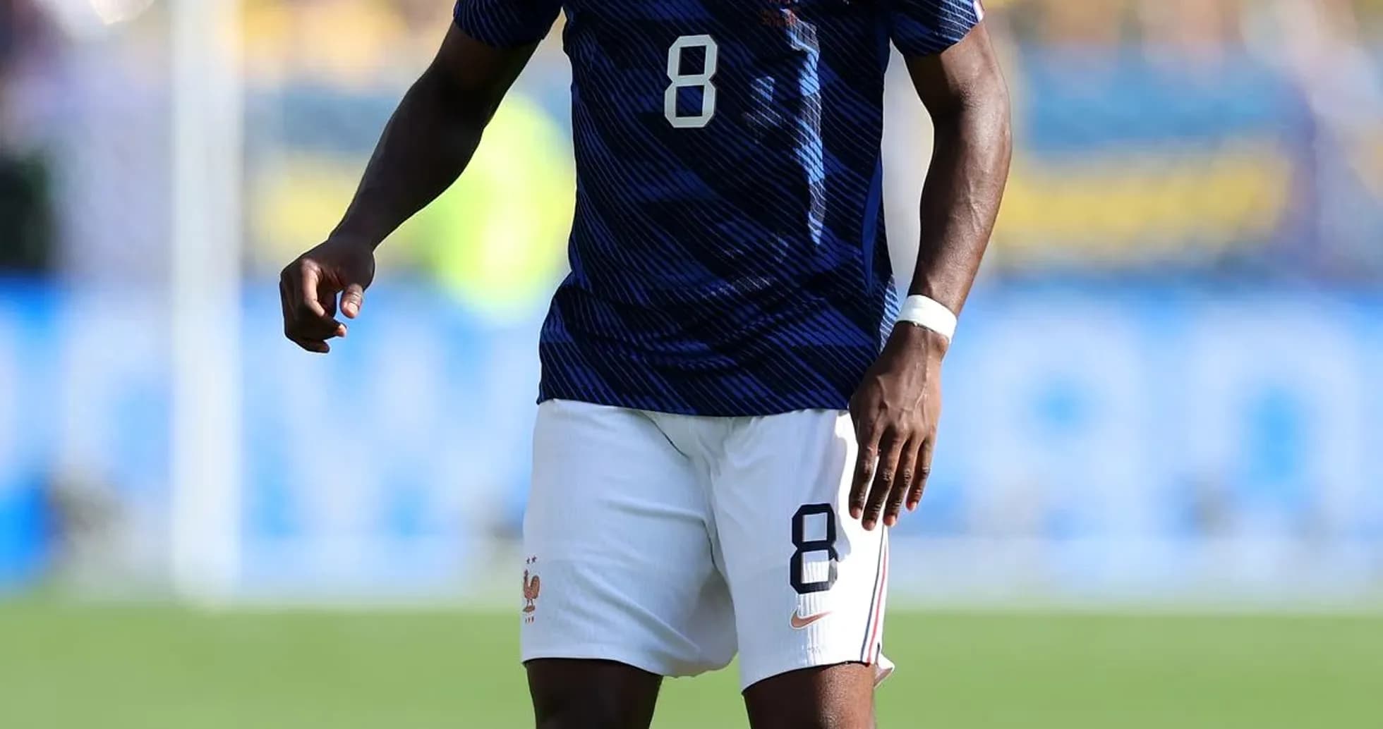 Player in France kit preparing for play on field