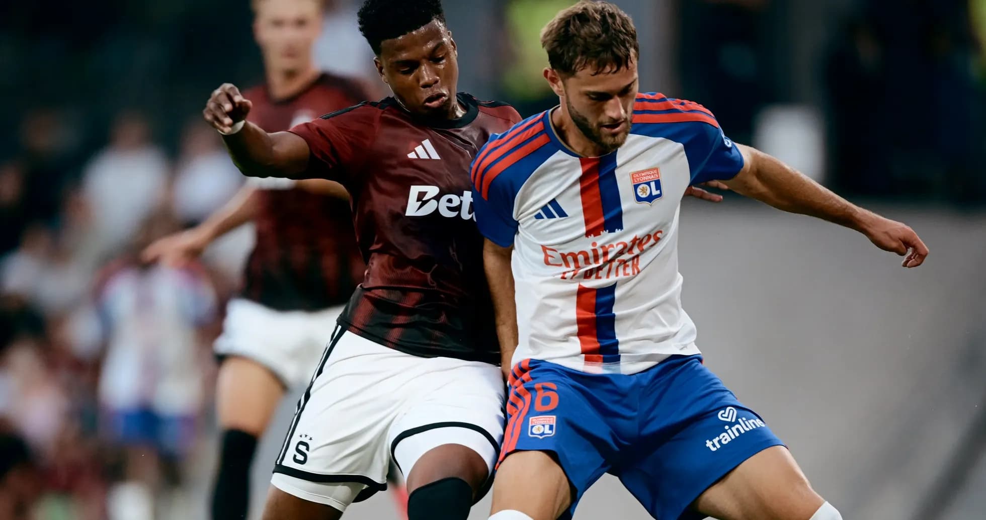 Lyon and Sparta Praha players battling for the ball