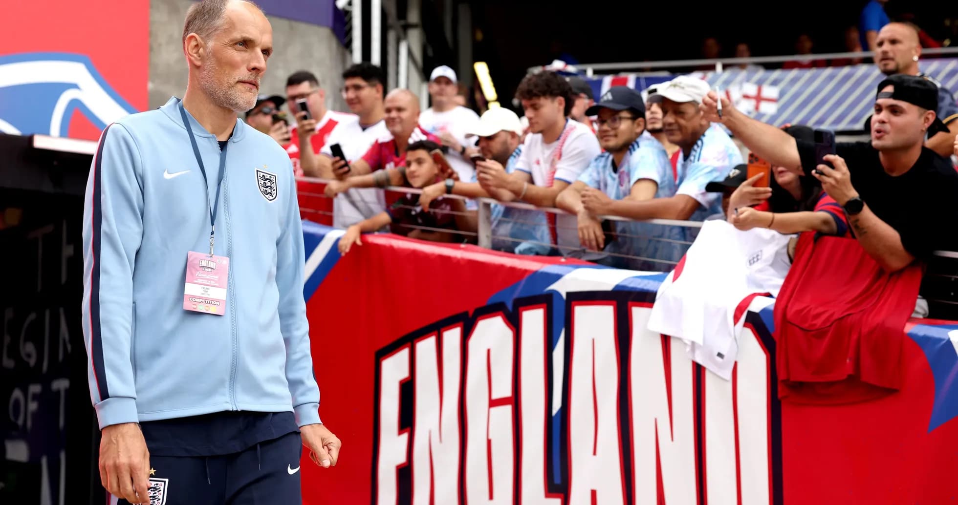 Manager walking past fans before the match