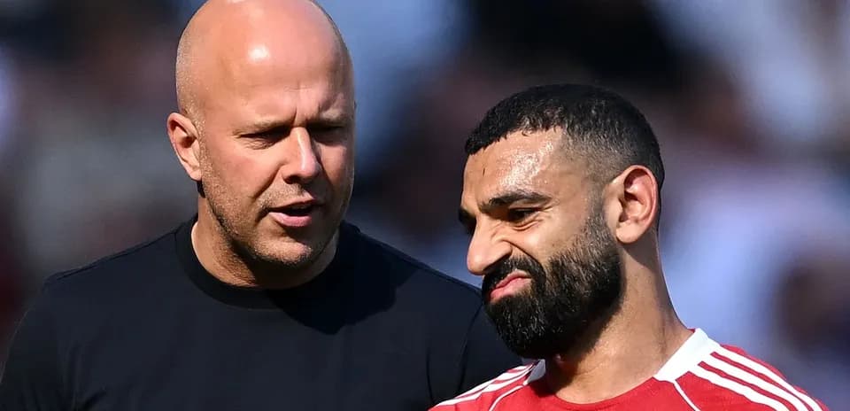 Two men talking on the field during match