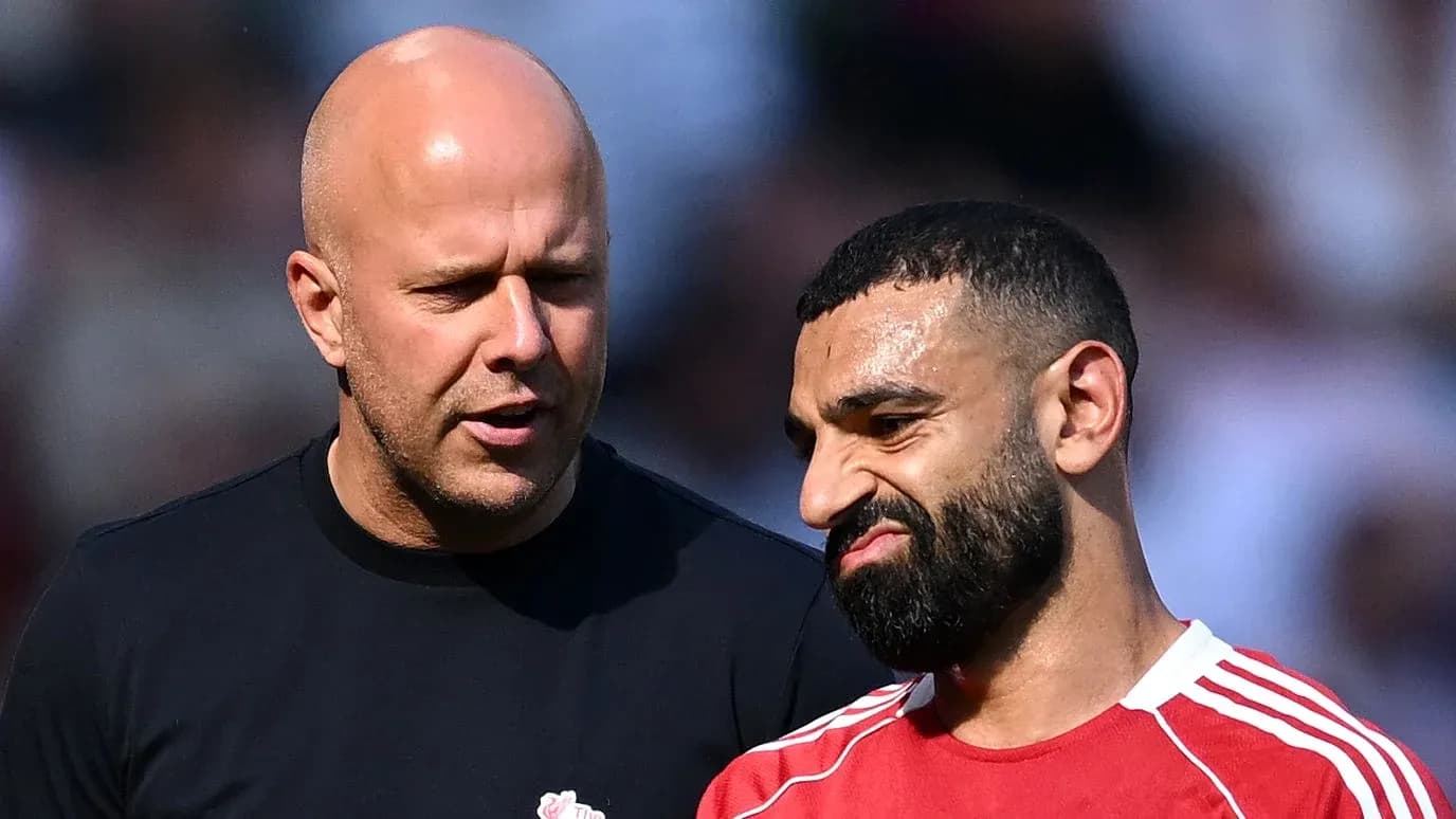 Two men talking on the field during match