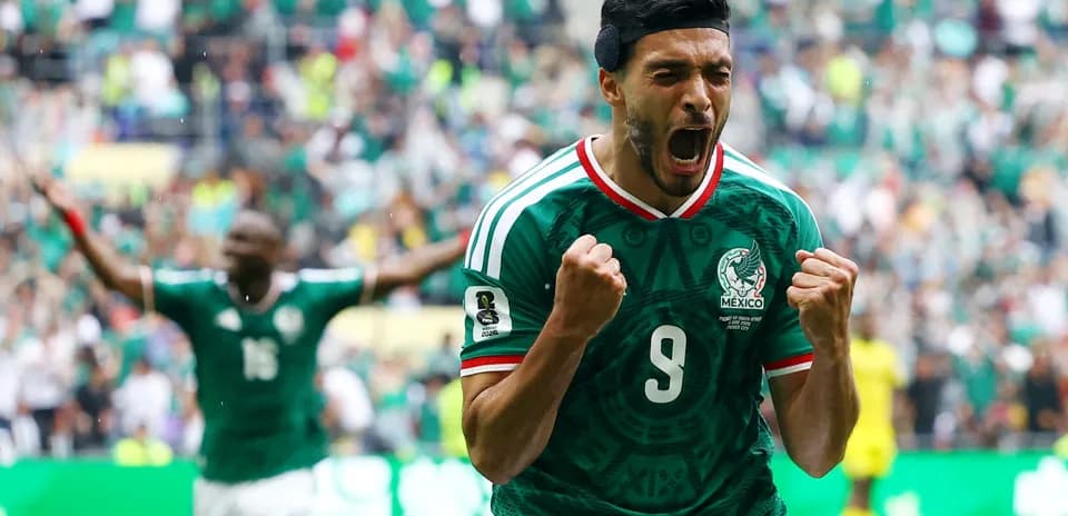 Player celebrating goal for Mexico during match