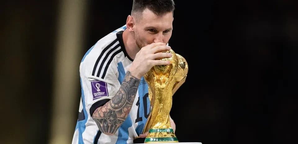 Player kissing the FIFA World Cup trophy