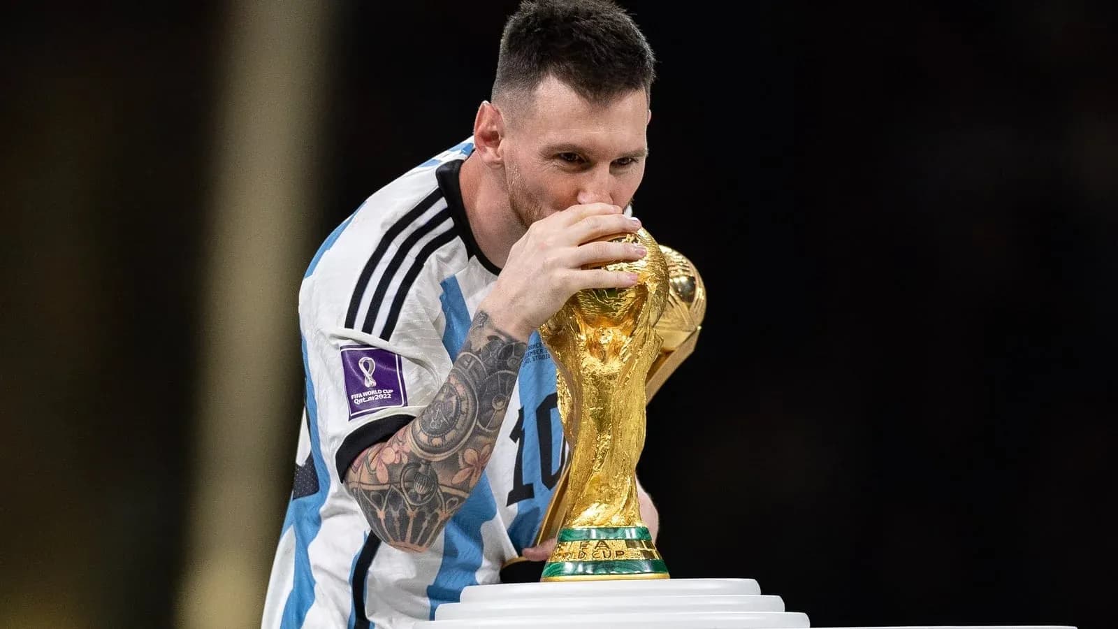 Player kissing the FIFA World Cup trophy