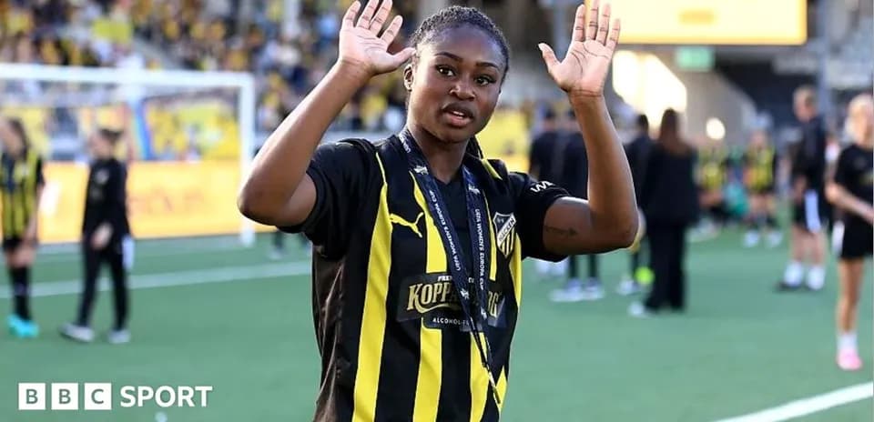 Player waving during post-match celebrations on field