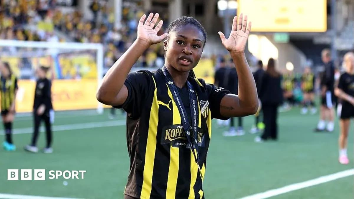Player waving during post-match celebrations on field
