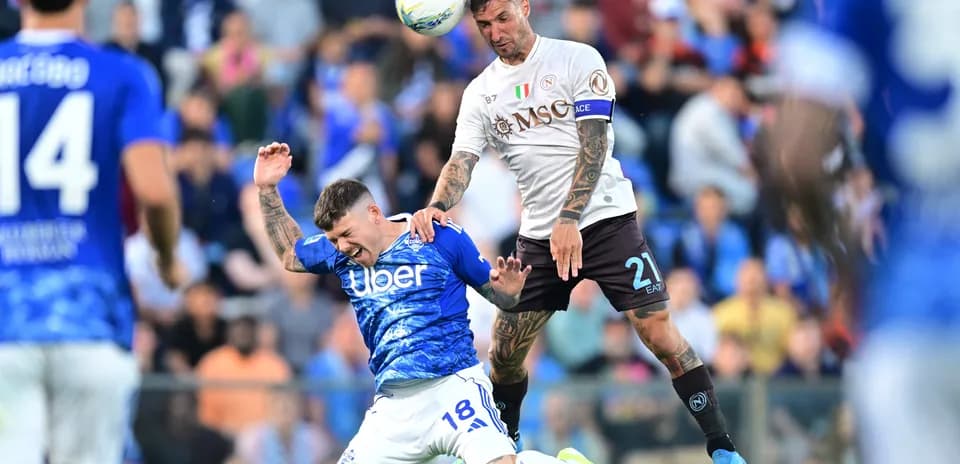 Napoli player challenges Como player during match