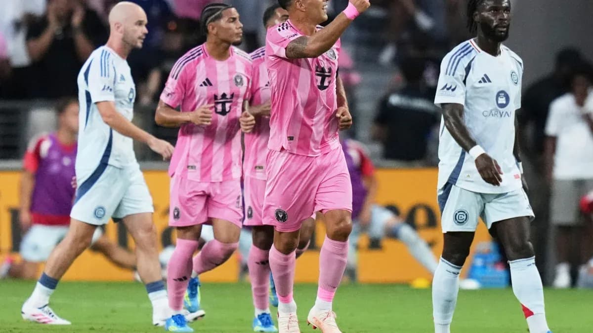 Players celebrating a goal during a soccer match