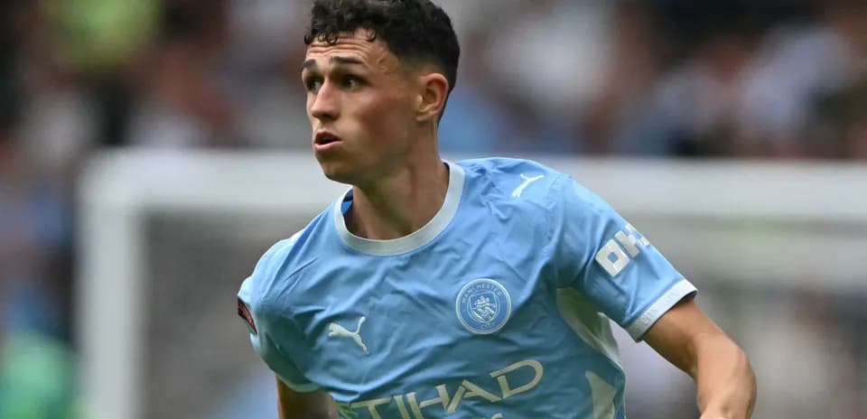 Phil Foden running during a Manchester City match