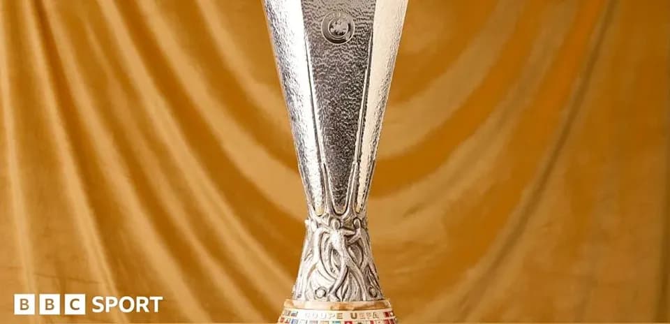 UEFA Europa League trophy displayed on golden background