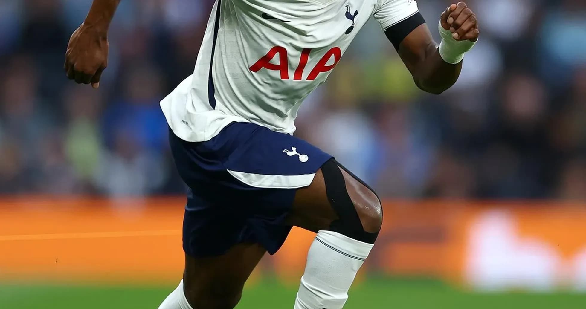 Player sprinting with ball during match