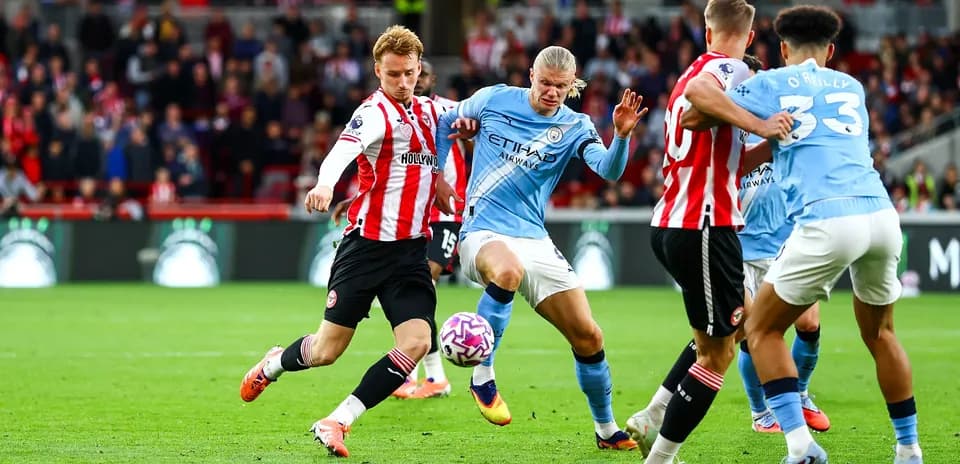 Players competing for the ball in match action
