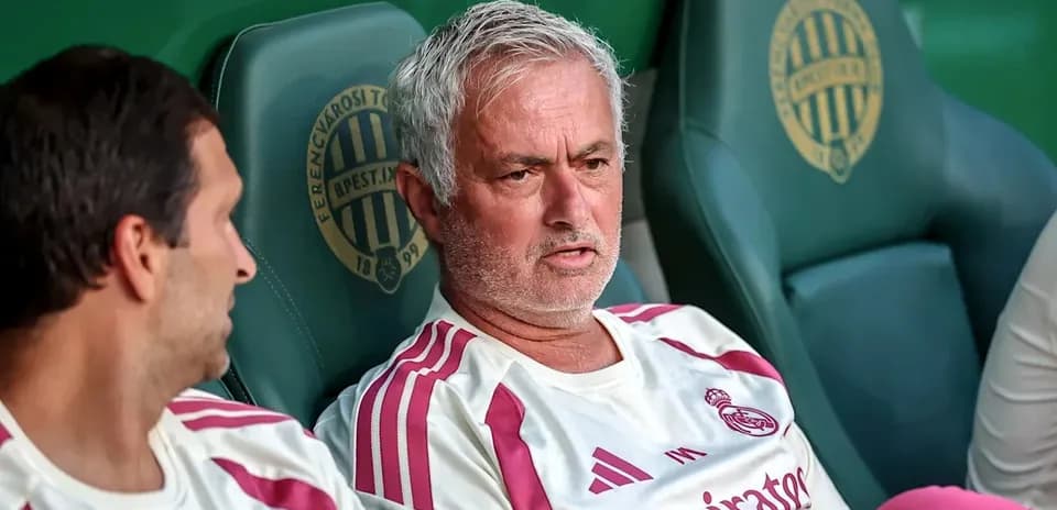 Coaches sitting on the bench during match