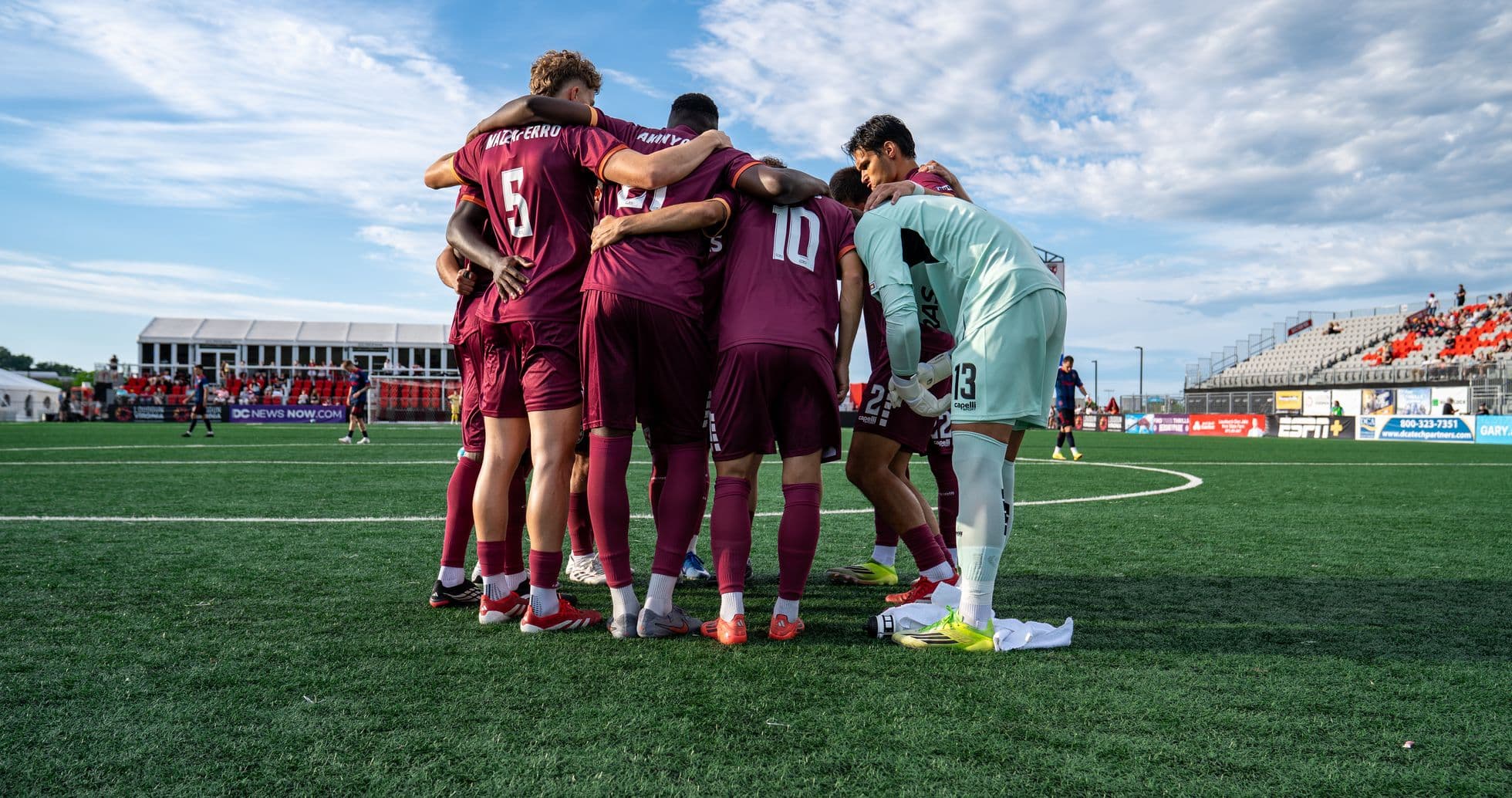Players huddling before the match