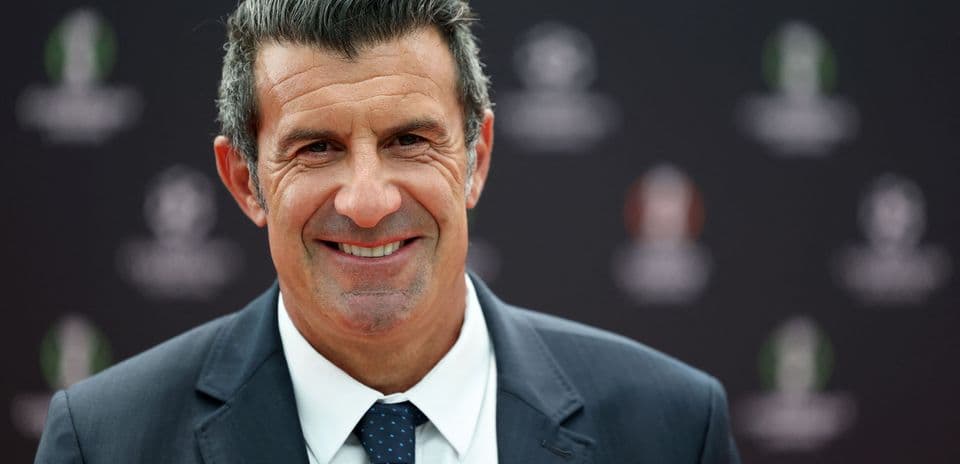 Man smiling in formal attire at event